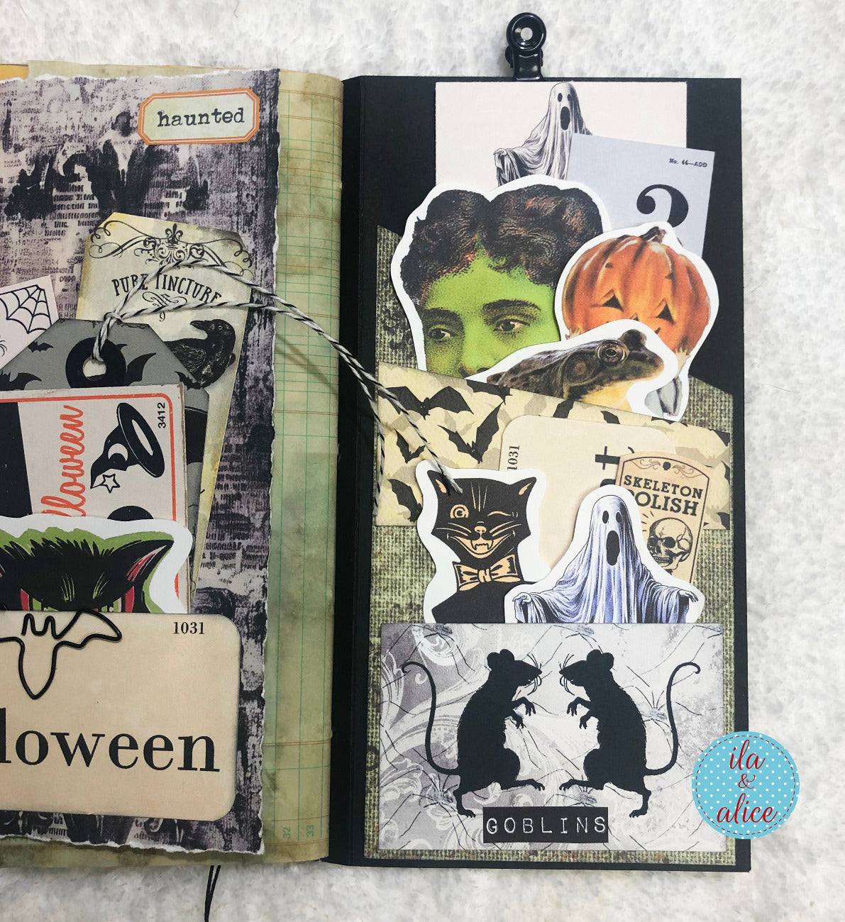 Halloween folio with Halloween-themed stickers on a textured surface