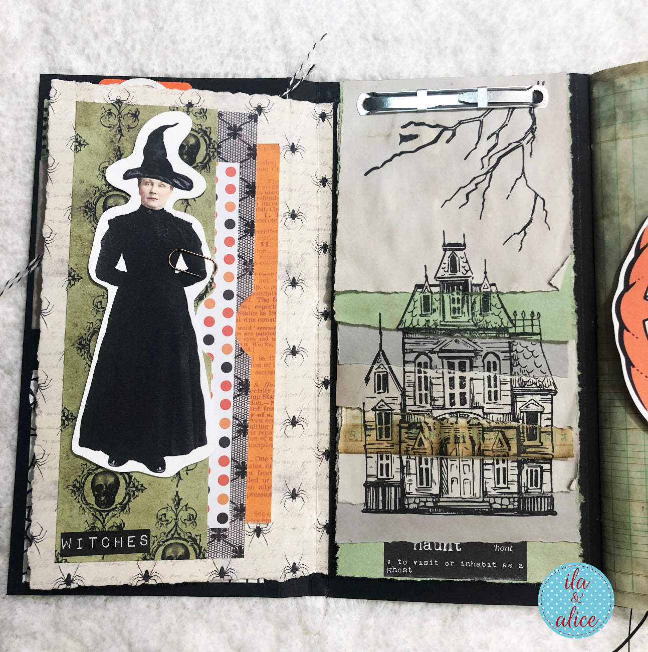 Open folio with Halloween-themed pages featuring a witch and haunted house illustration.