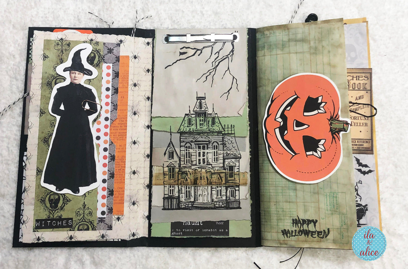 Open Halloween-themed folio with illustrations of a witch, pumpkin, and haunted house.