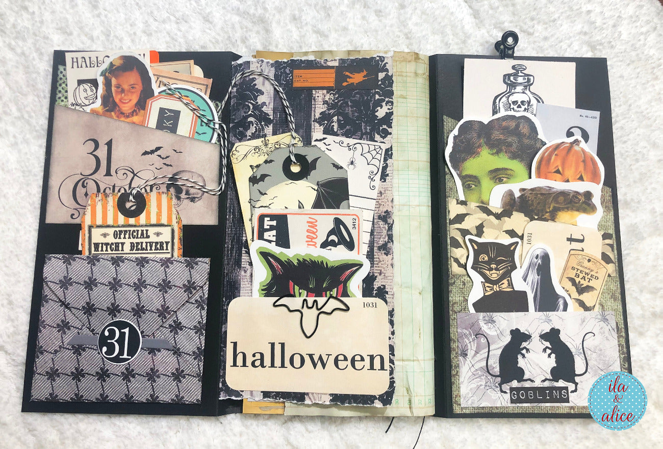 Halloween-themed folio with various designs on a textured surface.