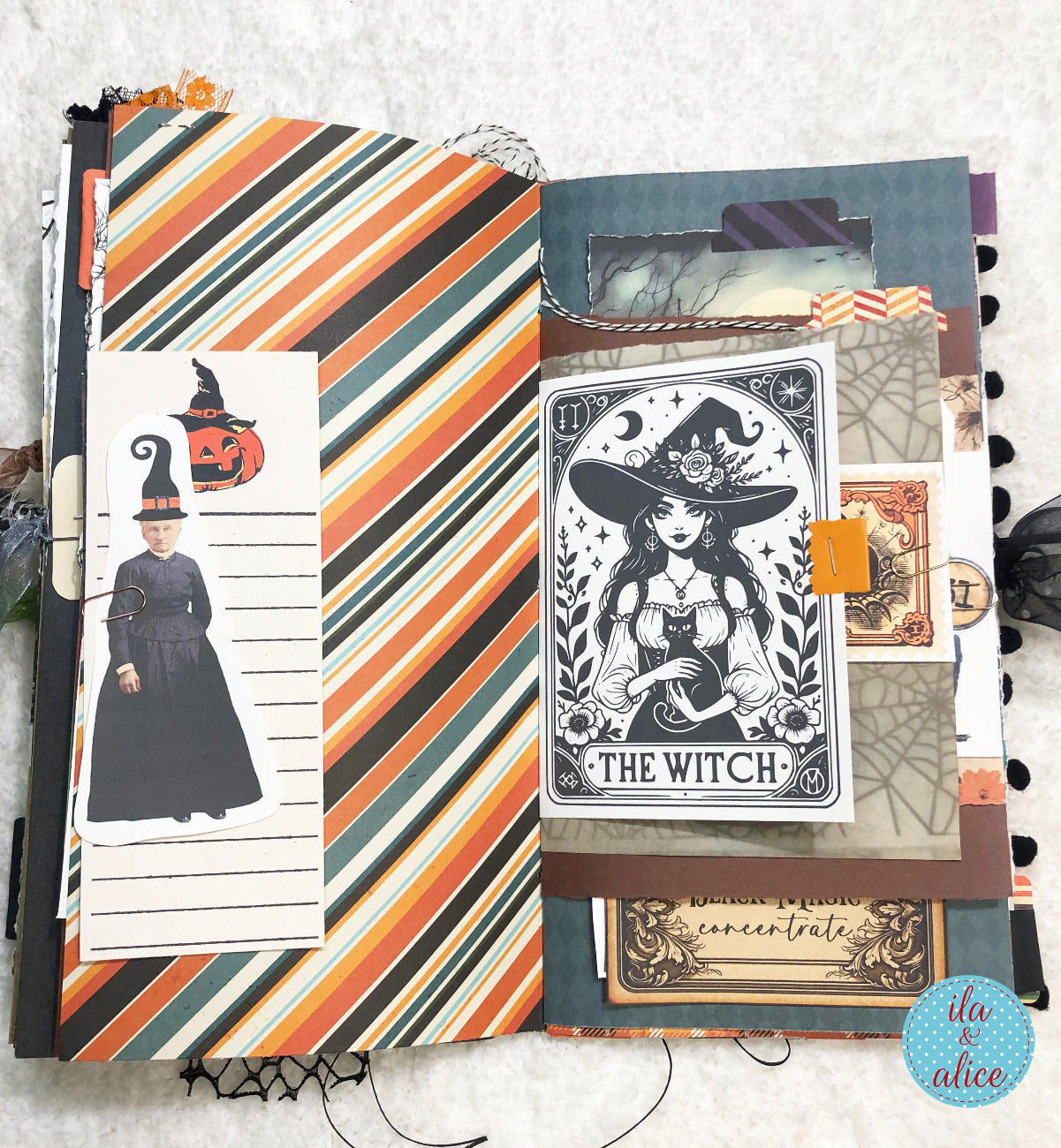 Handmade made Halloween junk journal with striped paper and 'The Witch' card.