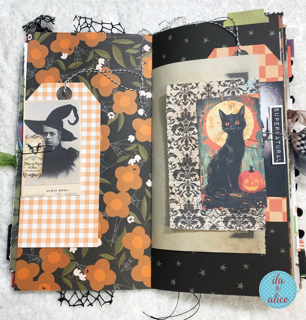 Handmade made Halloween junk journal w Halloween-themed pages featuring a black cat and vintage-style illustrations.