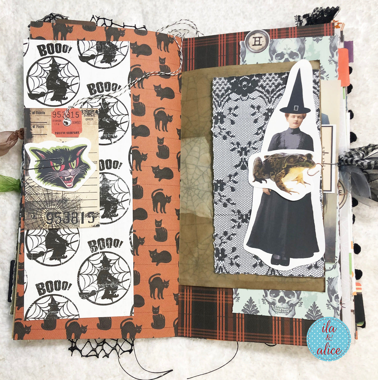 Halloween-themed scrapbook page with black cat, witch and toad on a textured surface.