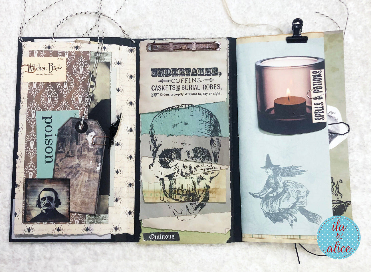 Open Gothic folio with Halloween-themed pages featuring a skull, candle, and other elements.