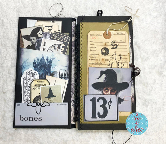 Open folio with Halloween-themed pages on a textured white background