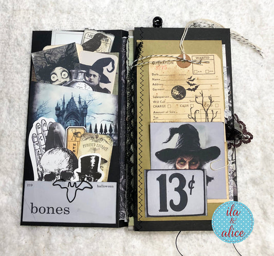 Halloween-themed folio junk journal with vintage-style illustrations on a textured surface.