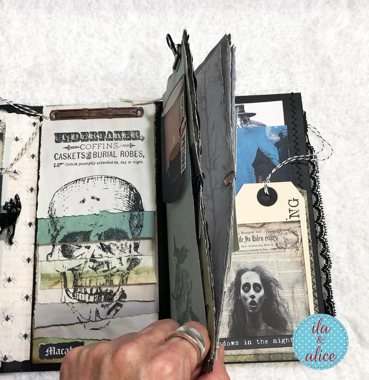 Open book with vintage-style pages featuring a skull illustration and text.