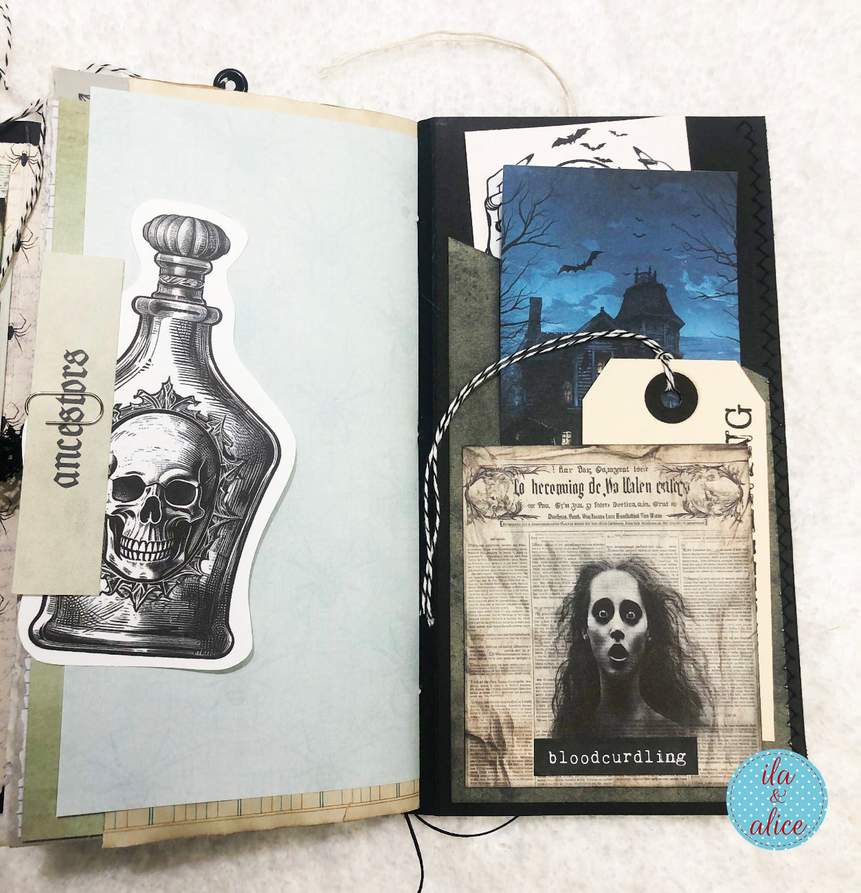 Handmade Halloween folio with Halloween-themed decorations including a skull decanter and ghost image.