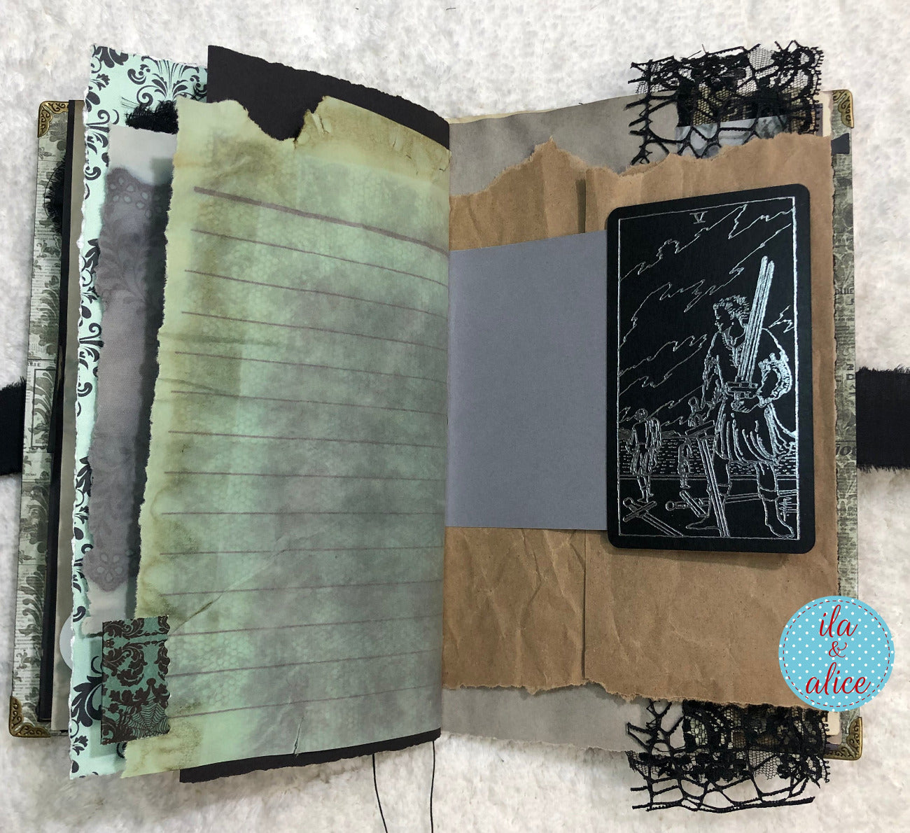 Handmade Eerie Halloween Gothic junk journal with a back and silver tarot card