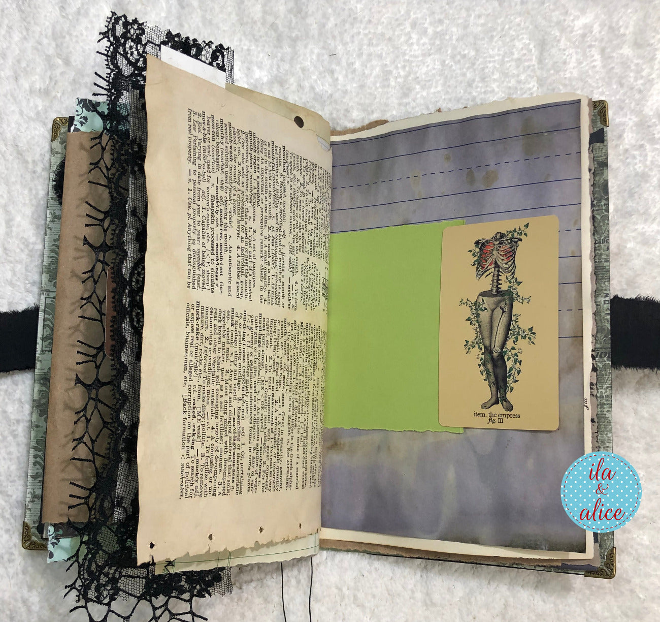 Handmade Eerie Halloween Gothic junk journal with text and a vintage-style illustration on a textured white background