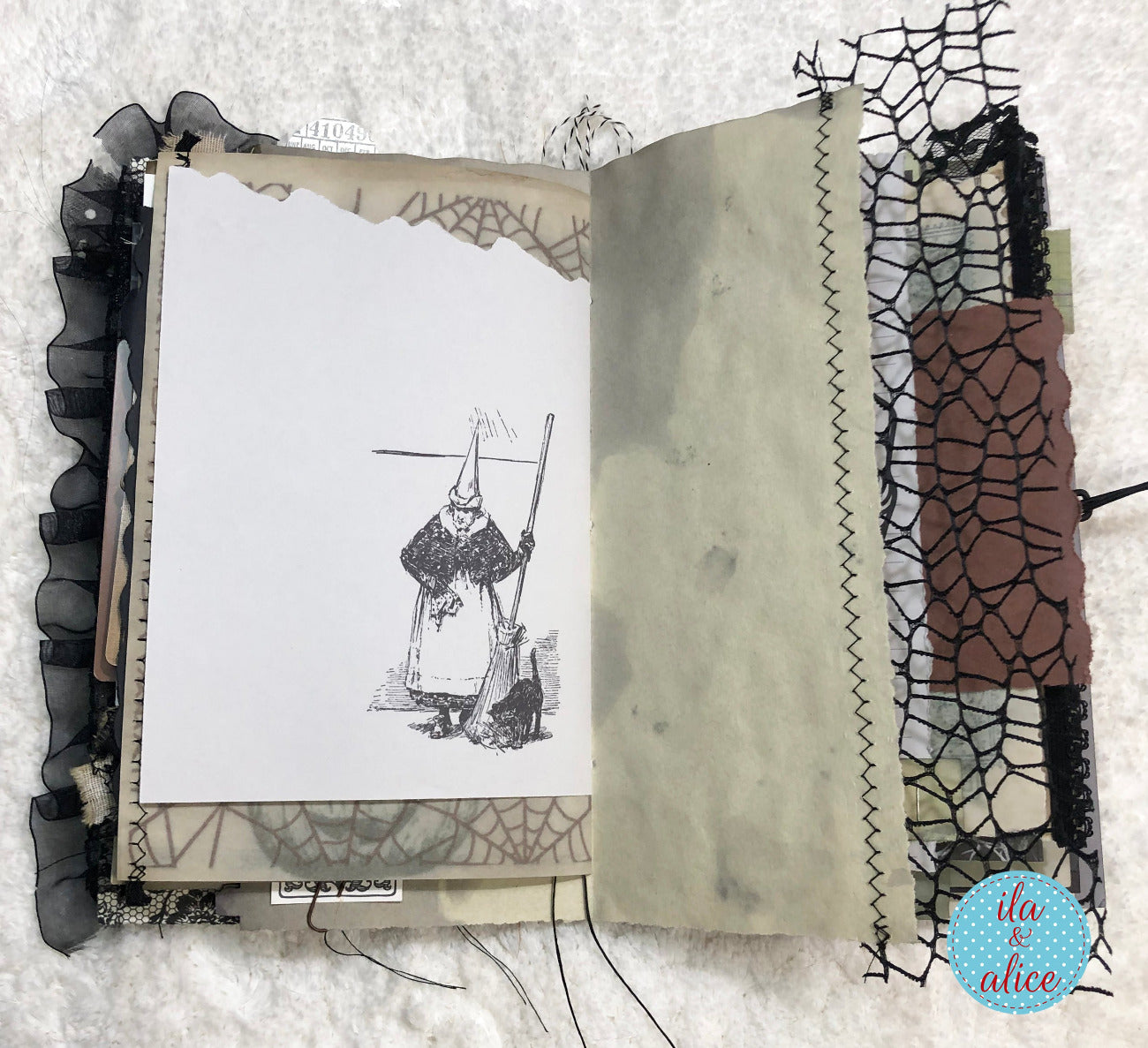 Handmade Halloween junk journal with a witch and black cat
