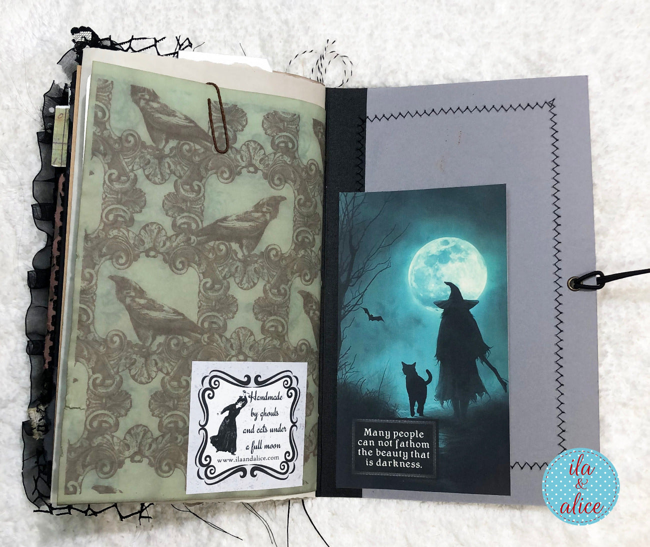 Handmade Halloween junk journal featuring a silhouette of a witch and moon.