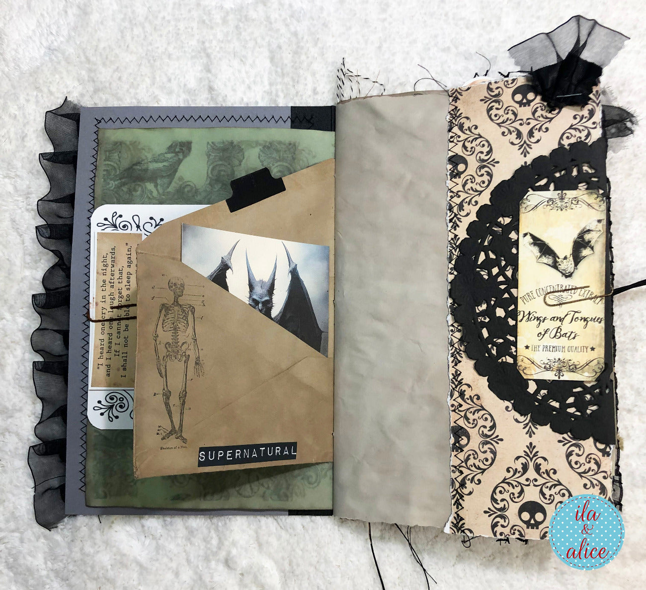 Handmade Halloween junk journal with skull-themed cover and skeleton illustration on a textured surface