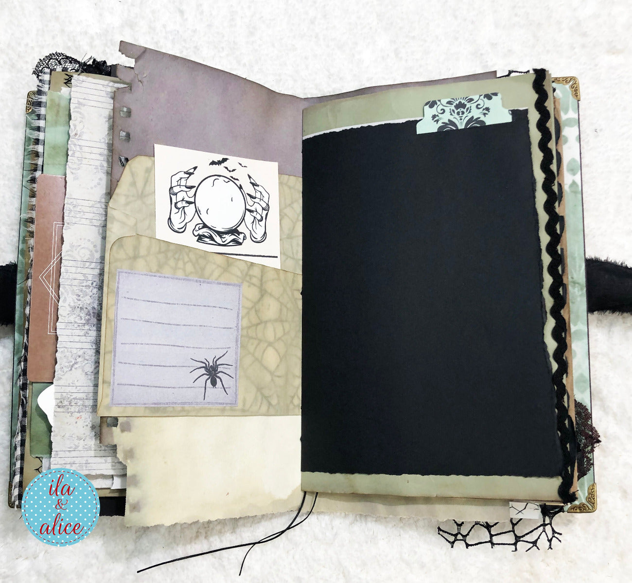 Handmade Eerie Halloween Gothic junk journal with decorative pages and spider illustrations on a white background