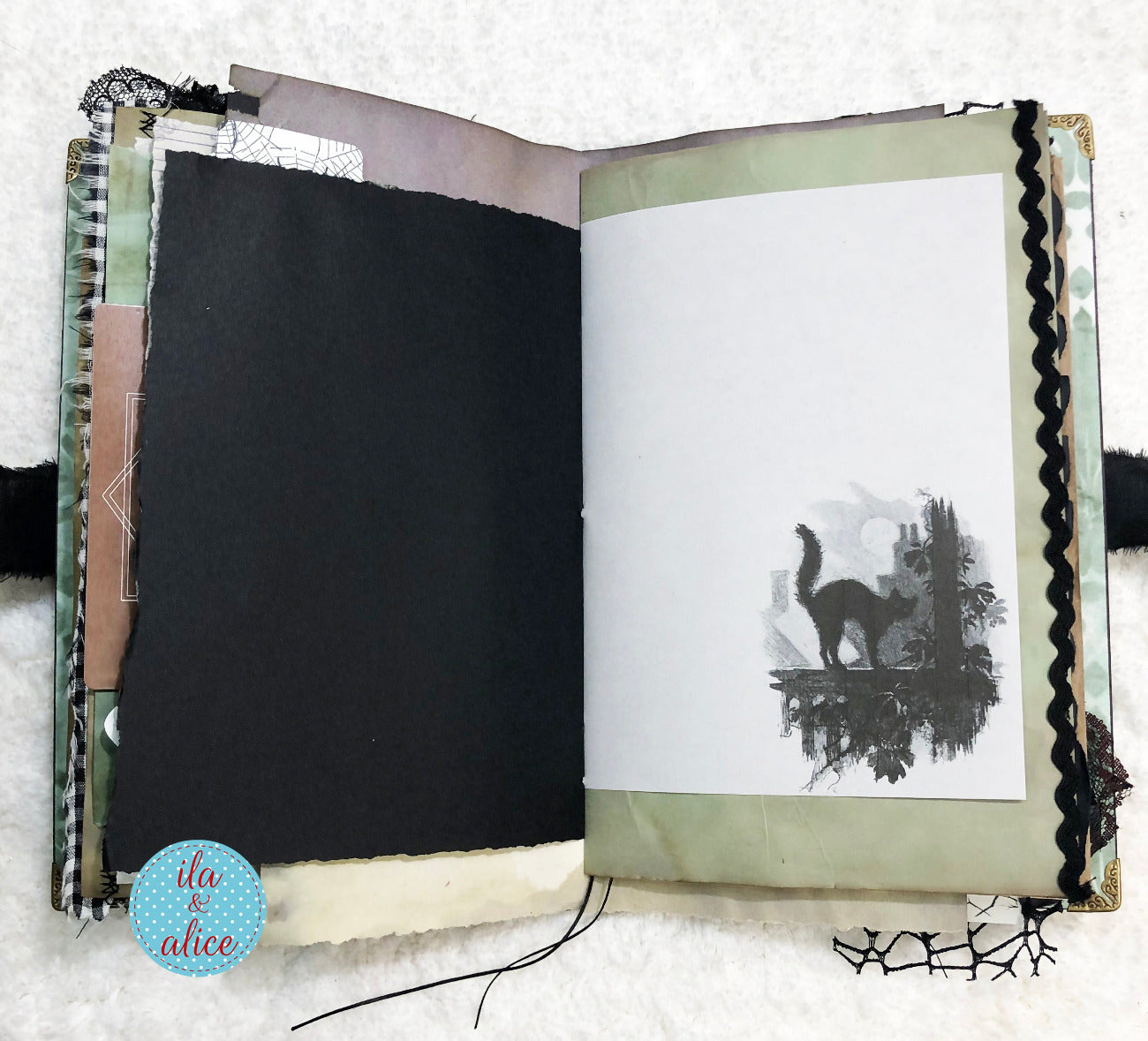 Handmade Eerie Halloween Gothic junk journal with black and white illustration of a cat on a white background