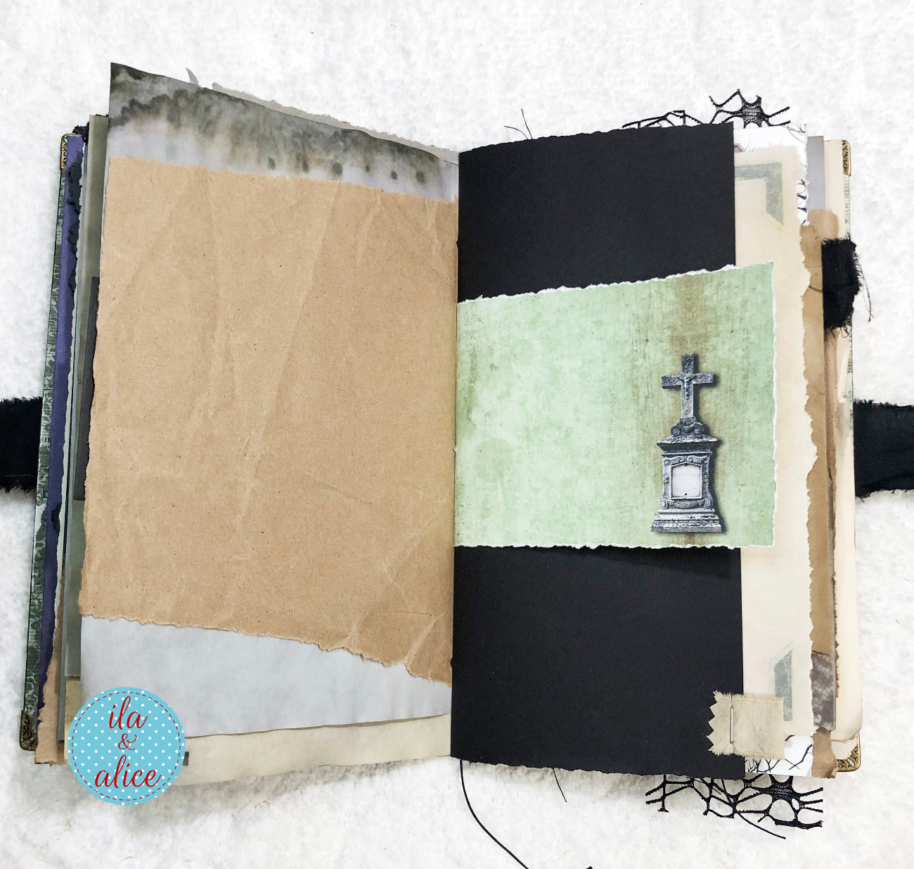 Handmade Eerie Halloween Gothic junk journal with textured pages and a gravestone illustration on a white background
