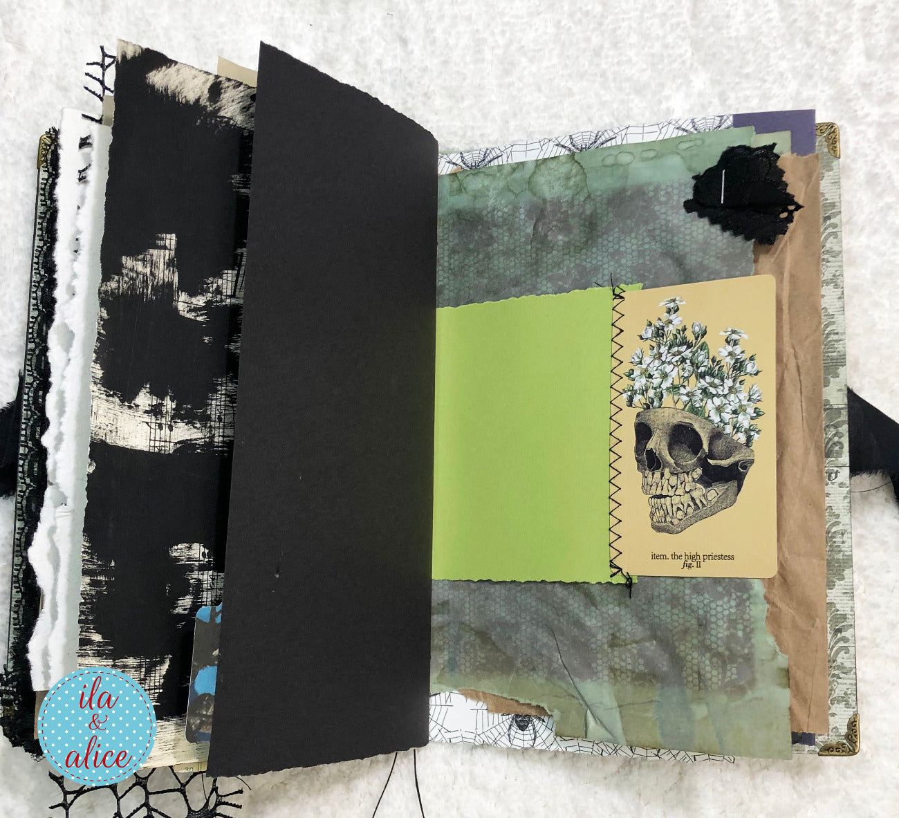 Handmade Eerie Halloween Gothic junk journal and a skull illustration on a textured white background