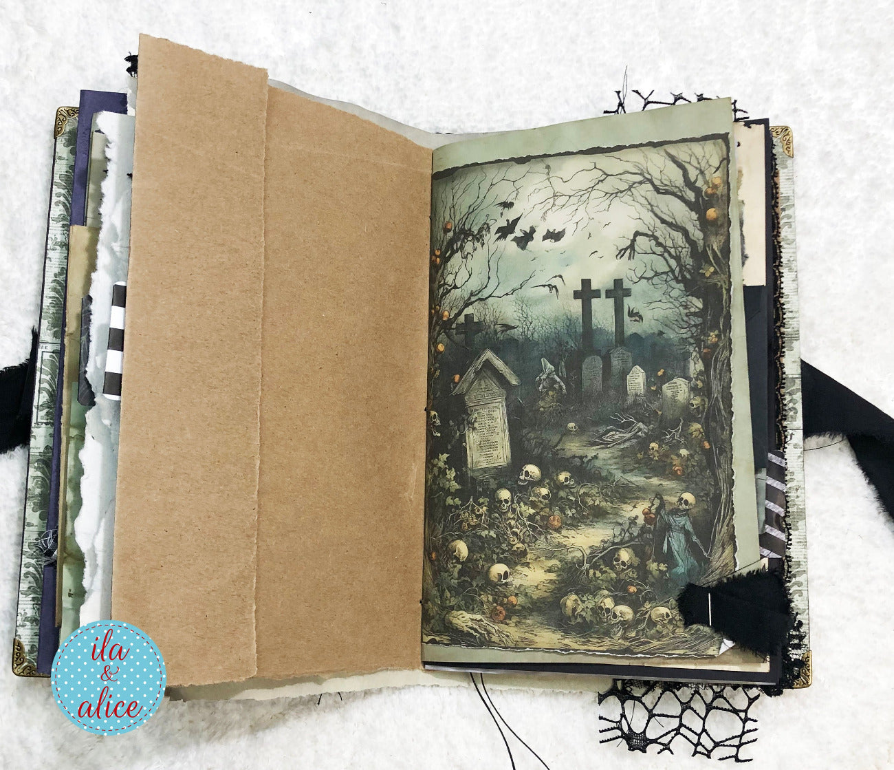 Handmade Eerie Halloween Gothic junk journal with a Halloween-themed illustration of a graveyard on a white background.