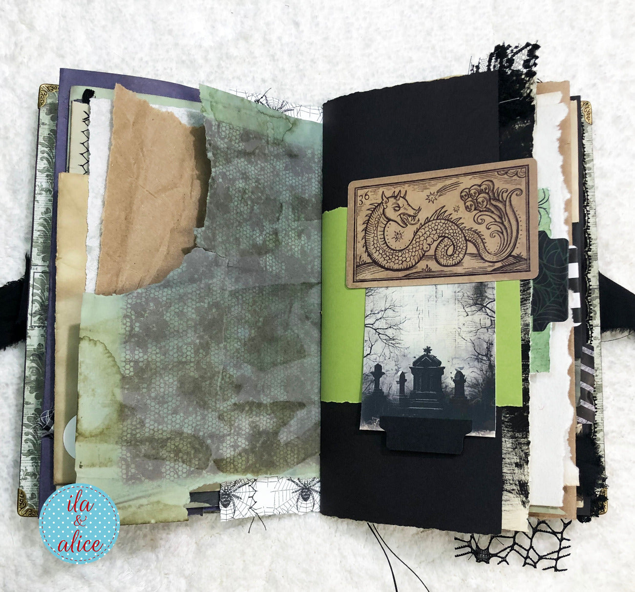 Handmade Eerie Halloween Gothic junk journal with textured pages and decorative elements on a white background
