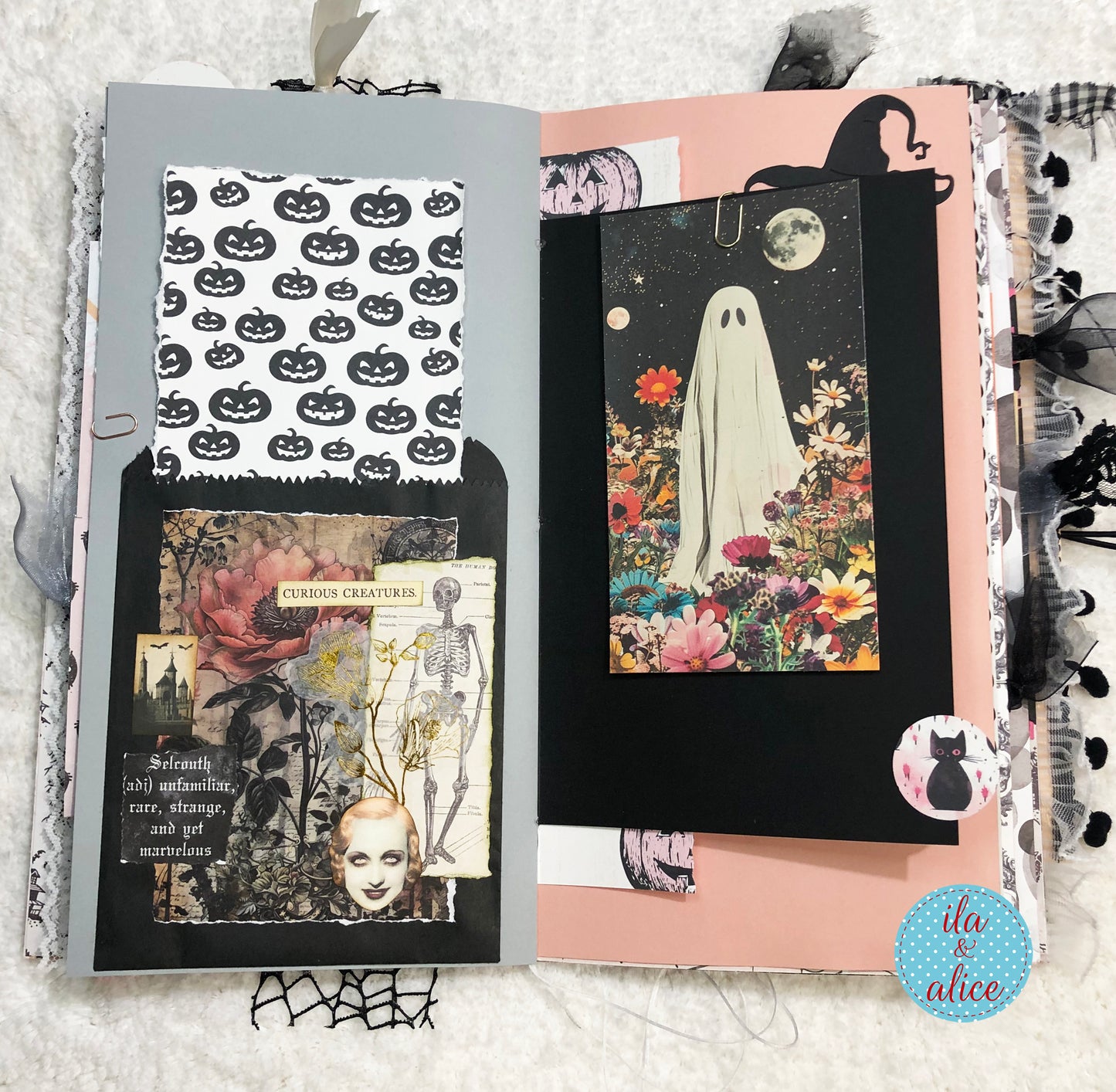 Open book with Halloween-themed pages featuring pumpkins, ghosts, and skeletons.