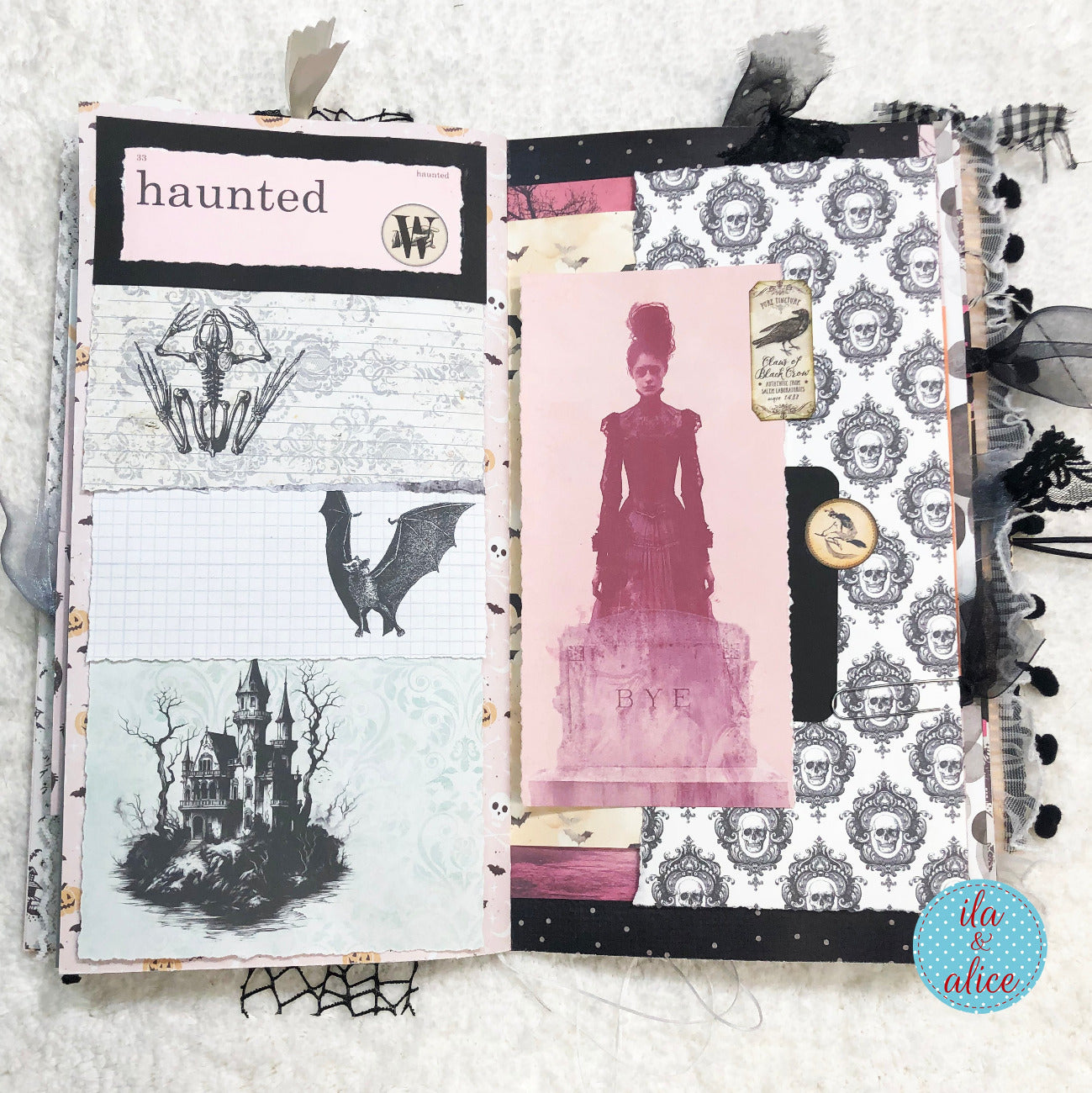 Handmade Pink and Black Halloween junk journal with Halloween-themed pages featuring skeletons, ghosts, bats, and a haunted castle.