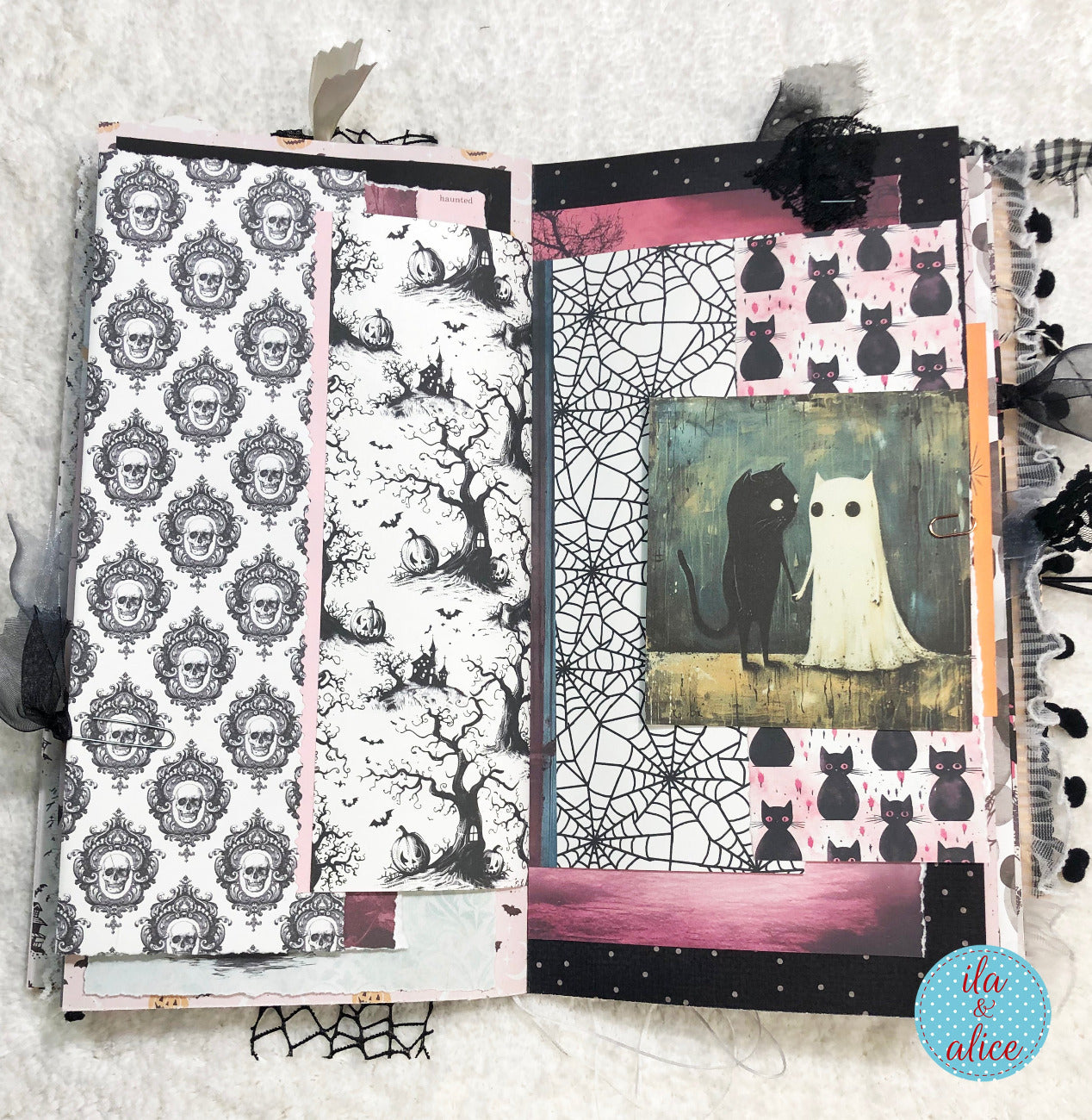 Handmade Pink and Black Halloween junk journal with Artistic collage with Halloween-themed patterns and images on a textured surface.