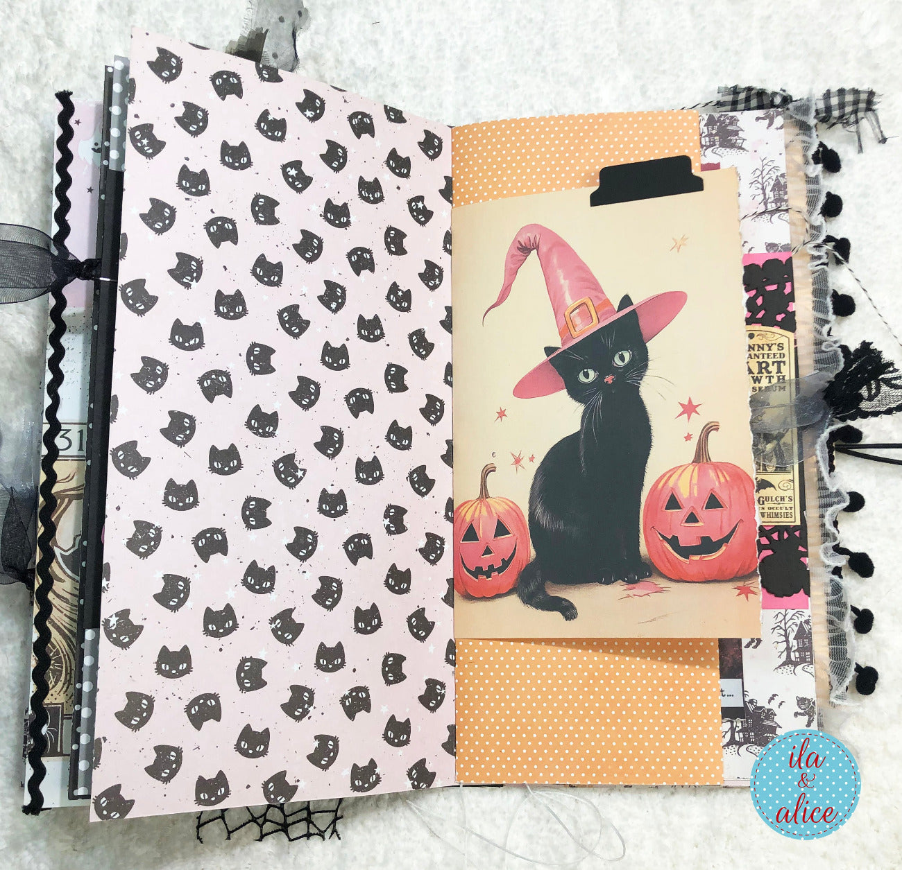 Handmade Pink and Black Halloween junk journal with black cat pattern and vintage-style design.