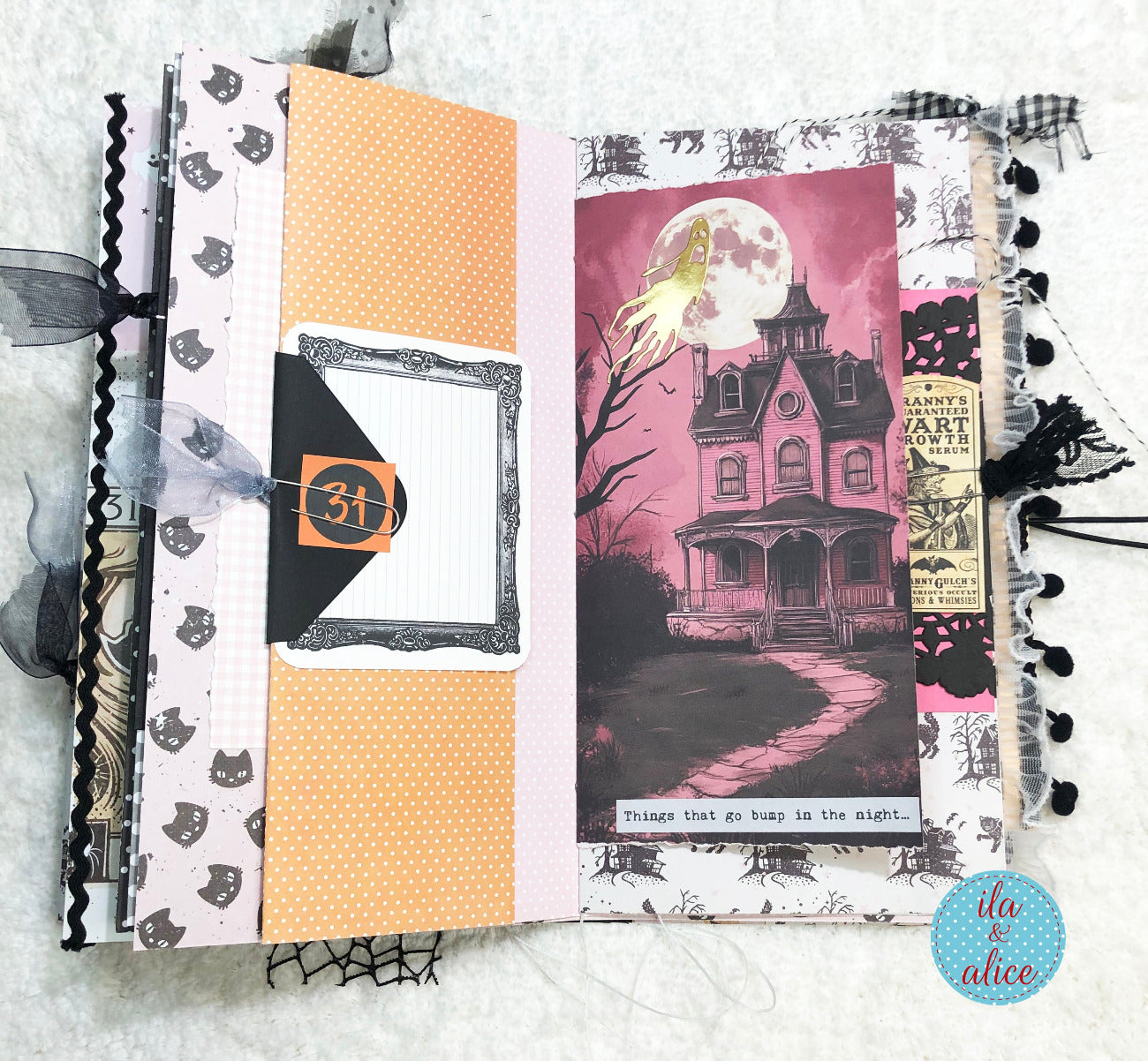 Handmade Pink and Black Halloween junk journal with pink haunted house