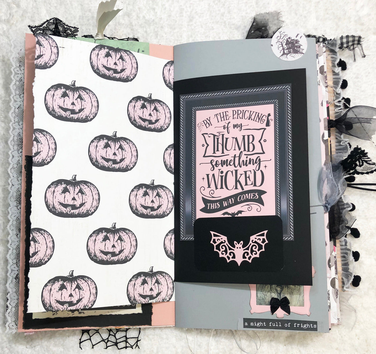 Handmade Pink and Black Halloween junk journal with pumpkin pattern and quote design