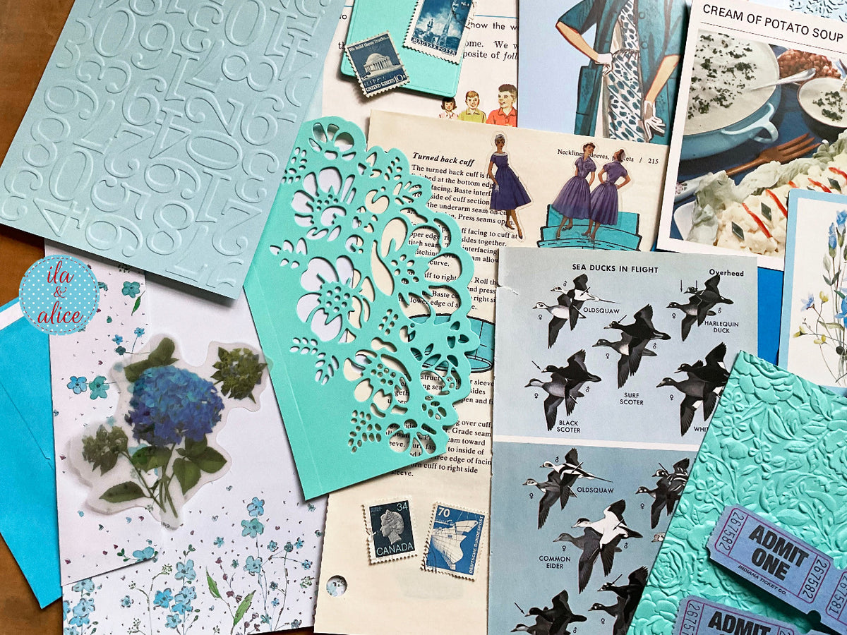 Curated 8x12 junk journal ephemera pack with layered papers, botanical elements, and tuck-able pieces. Blue theme.