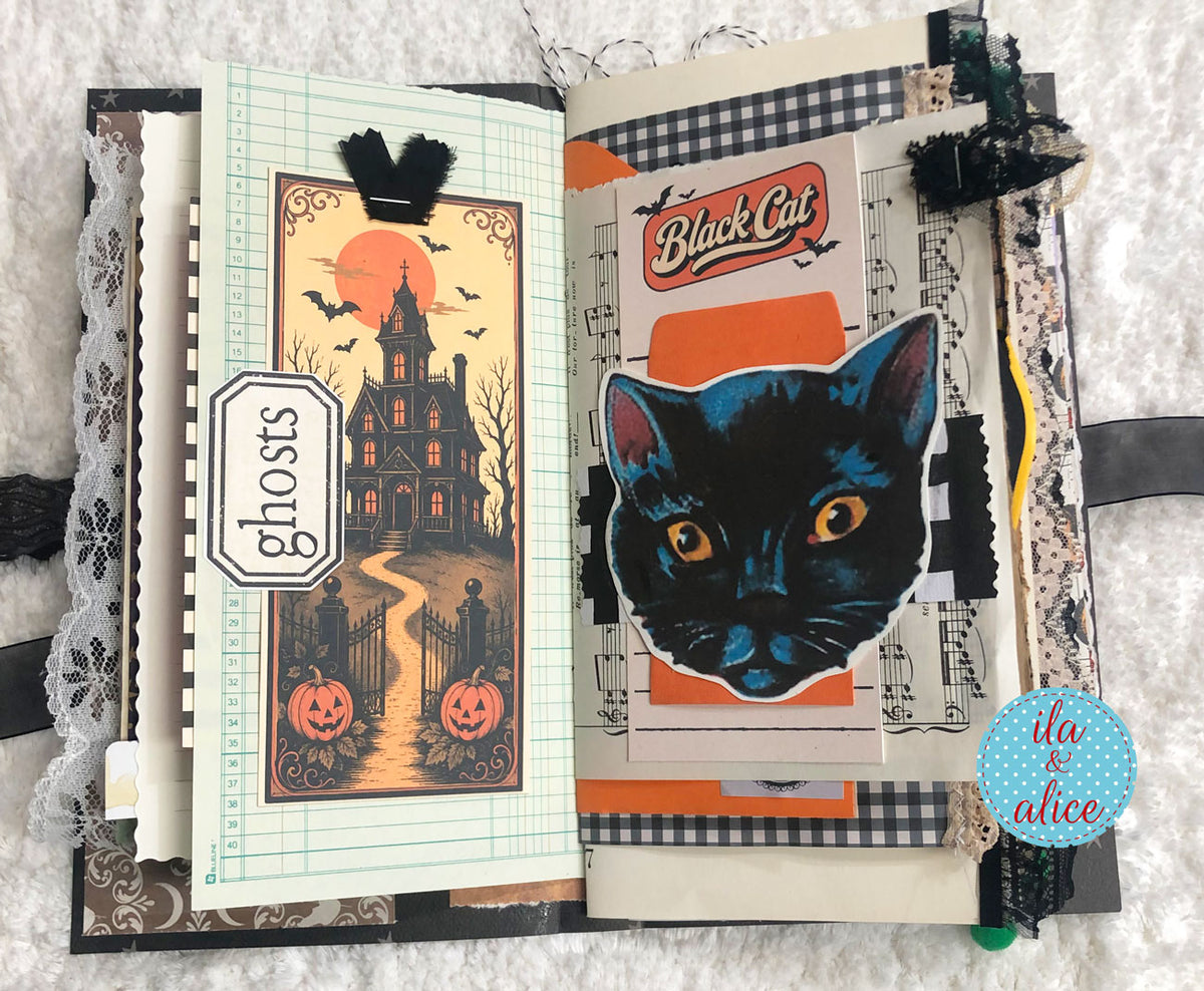 An open handmade Halloween scrapbook journal with two decorated pages. The left page features a spooky haunted house illustration under a full moon with pumpkins and a 'ghosts' label.