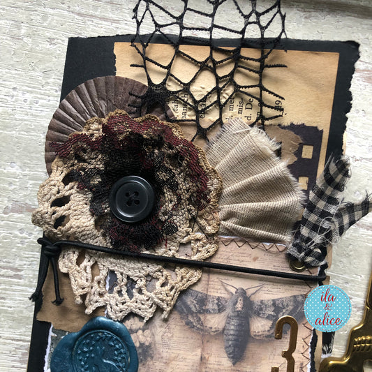 handmade spooky junk journal folio with wax seal, vintage ephemera, and dark folklore aesthetic