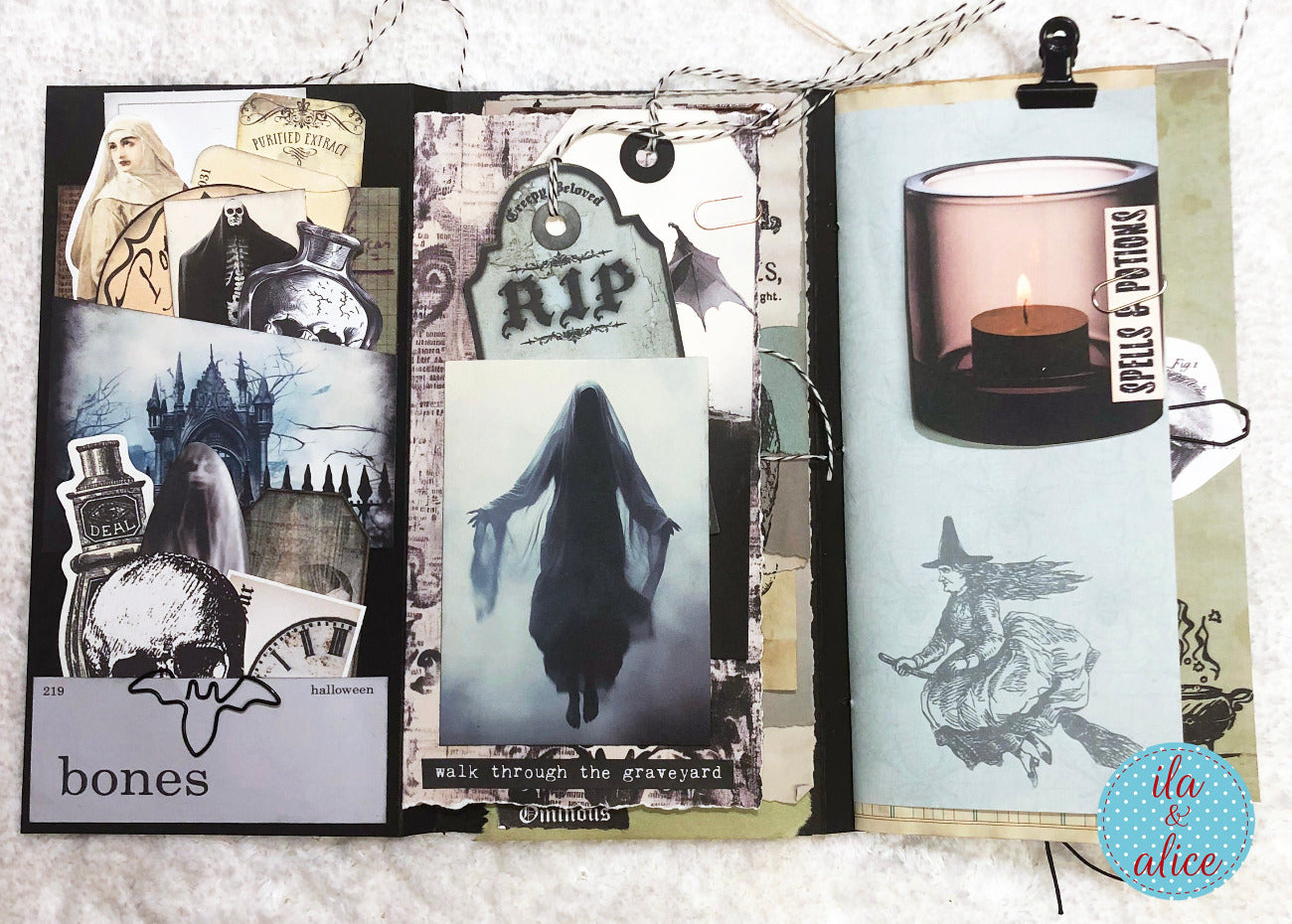 Open Gothic folio with Halloween-themed pages featuring ghosts, candles, and other spooky elements.