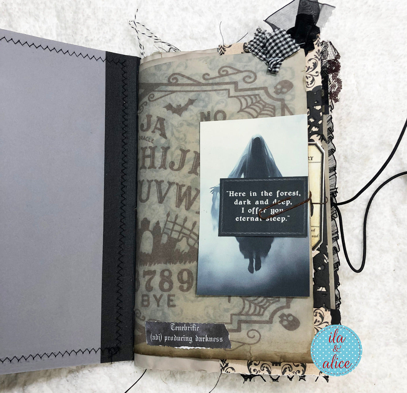 A handmade gothic-themed scrapbook album or journal page featuring a ghostly illustration, vintage tombstone text, black lace, ribbon, and a quote card reading, 'Here in the forest, dark and deep, I offer you, eternal sleep.