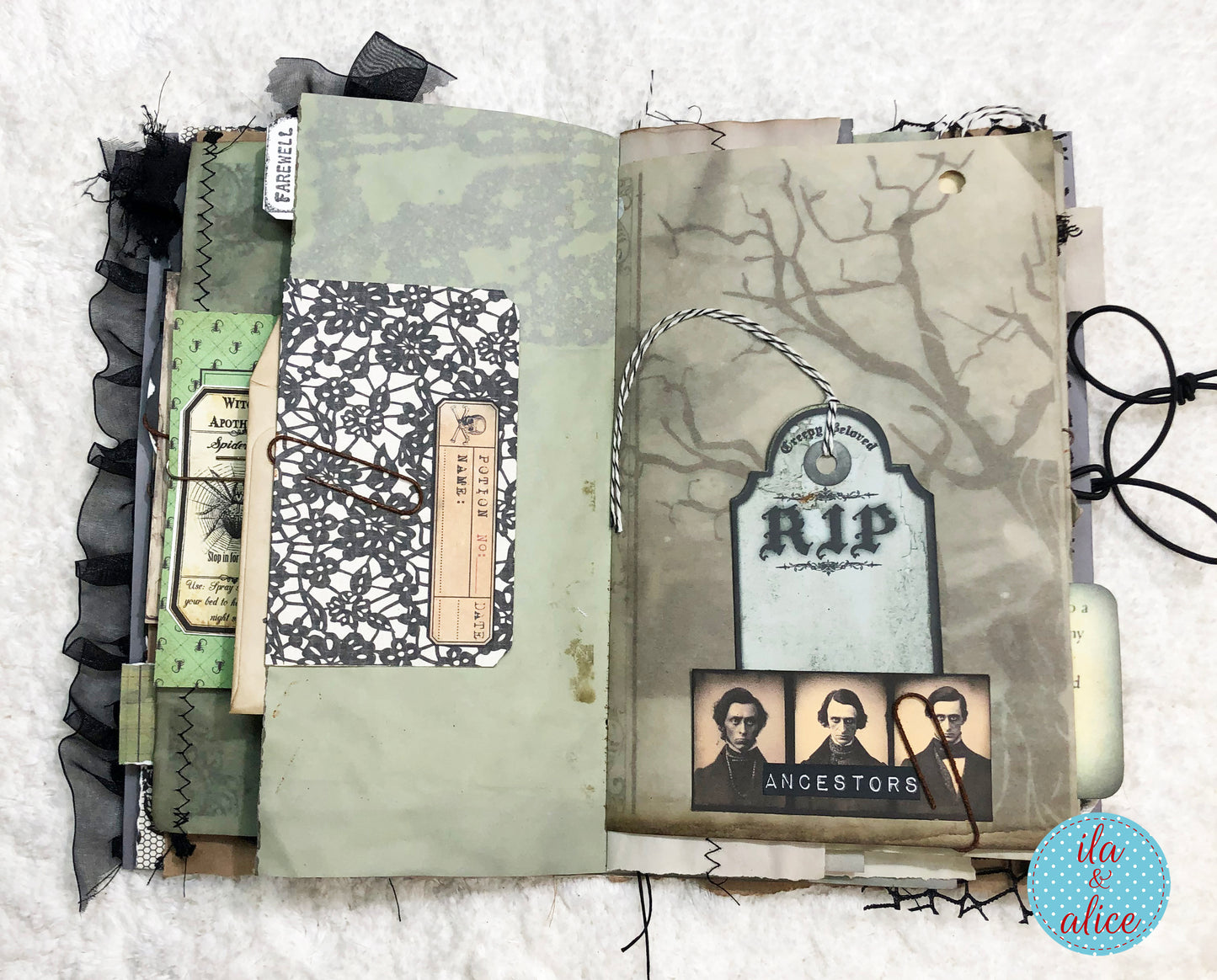 A handmade gothic-themed scrapbook journal page or album spread featuring layered vintage paper elements, black lace, ribbon, a tombstone 'RIP' label, and three portrait photos labeled 'ANCESTORS' on a white textured background.