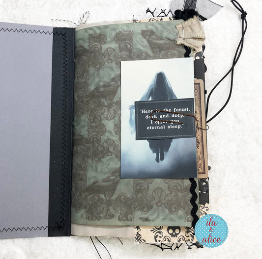 A handmade gothic scrapbook journal page featuring a ghostly illustration with the quote 'Here in the forest, dark and deep.