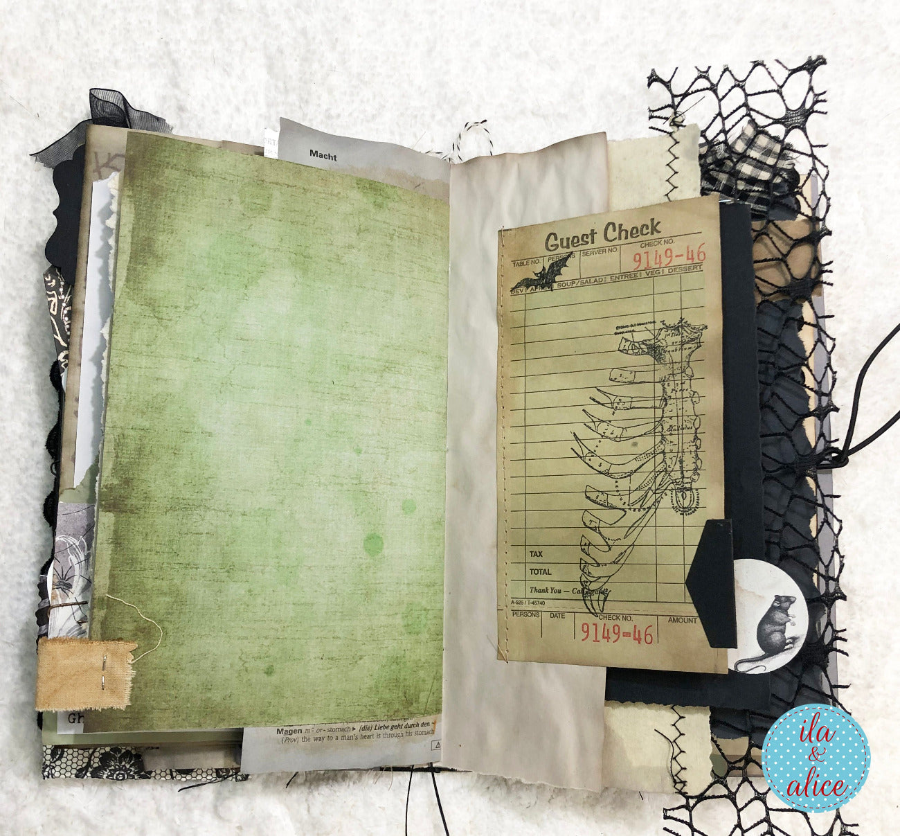 An open handmade scrapbook journal or art journal featuring a layered collage design. The left page is a textured sage green paper, while the right page features vintage-style elements including a 'Quiet Check' receipt, a black cat silhouette, black lace, and a black binder clip.