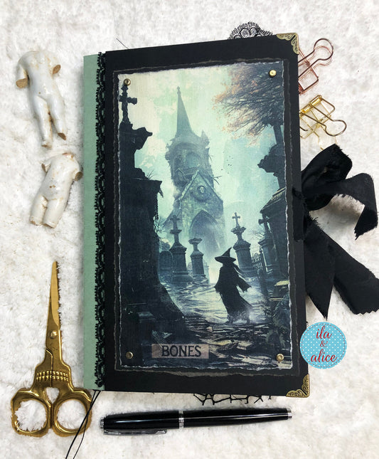 Handmade Eerie Halloween Gothic junk journal  with a gothic design featuring a silhouette of a person in a cemetery, surrounded by decorative items like scissors and ribbons.