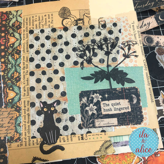Layered journal page with a black cat, botanical papers, and Midnight Findings “The quiet hush lingered” ephemera card.