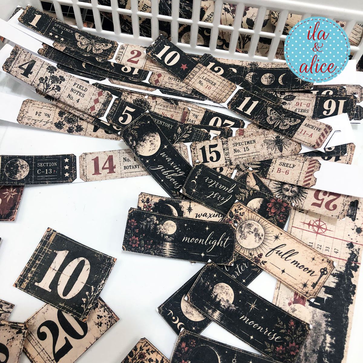 Cut number tickets, moon phase labels, weekday strips, and gothic paper ephemera from the Midnight Findings kit.