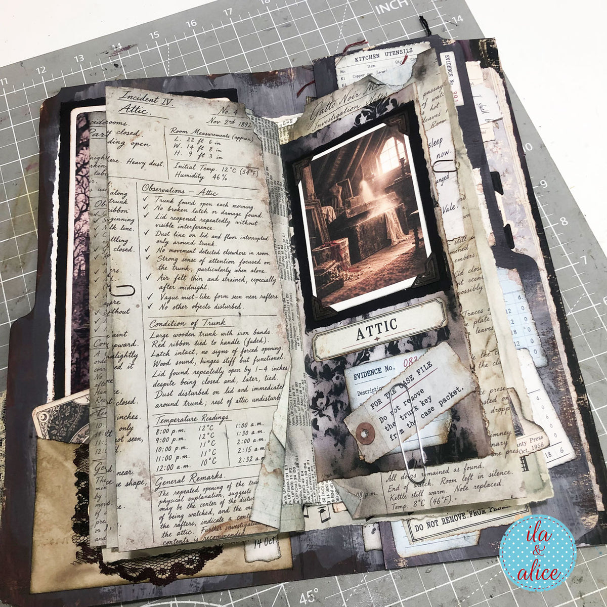 Layered Gatto Noir Manor ephemera arranged in a handmade gothic journal