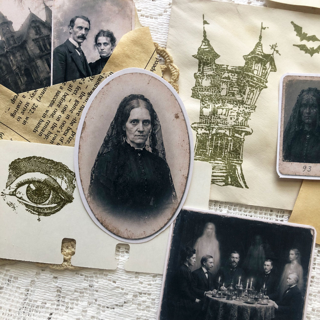 Close-up of gothic junk journal supplies including coffee-dyed tags, spooky stamps, and vintage-style portraits.