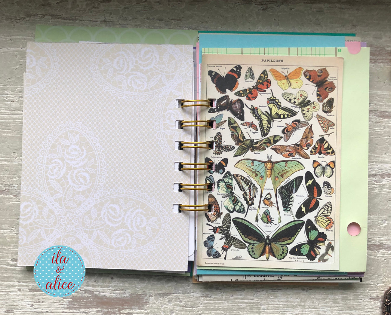 Planner with butterfly design on a wooden surface