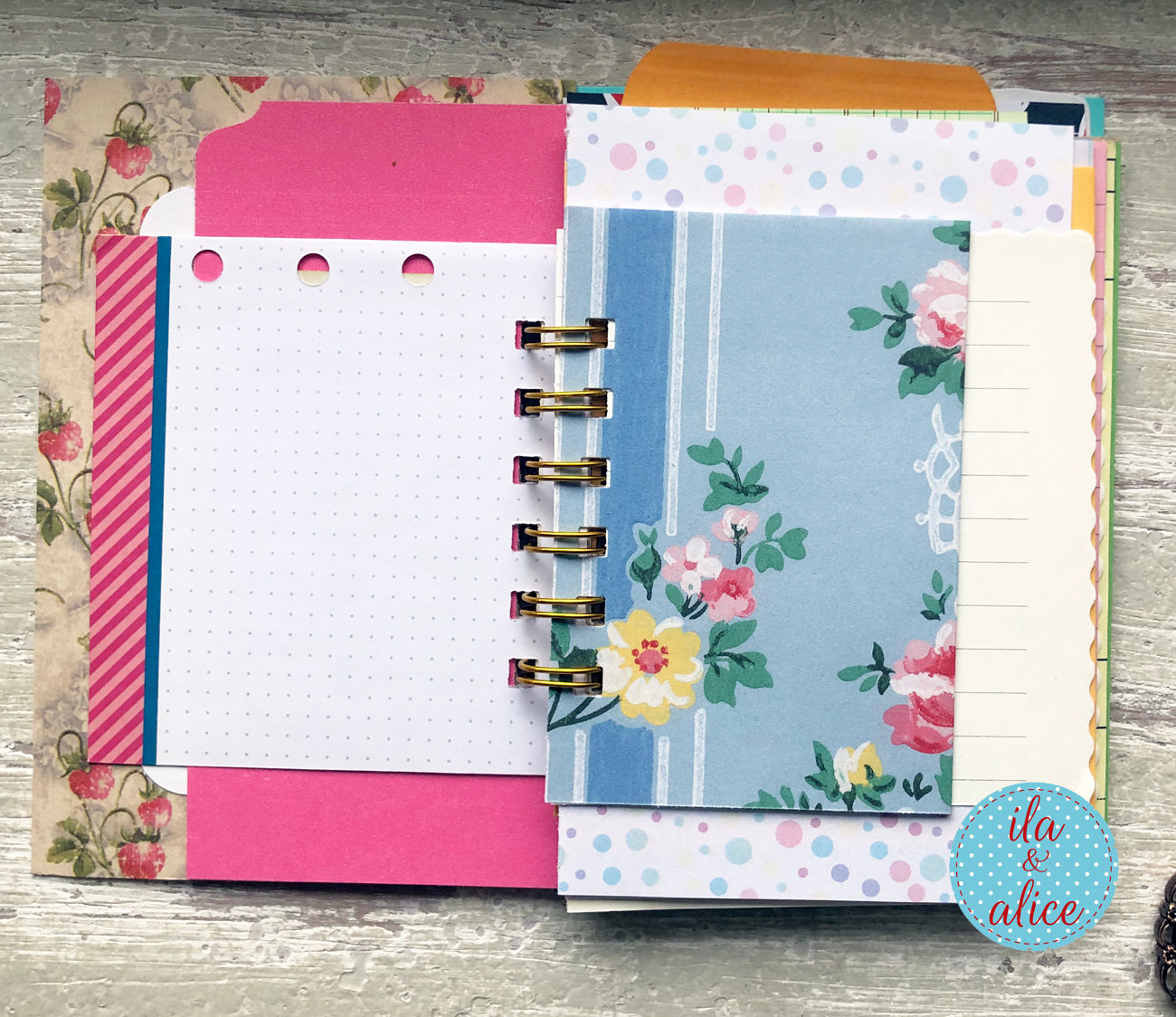 Planner with floral and polka dot designs on a wooden surface