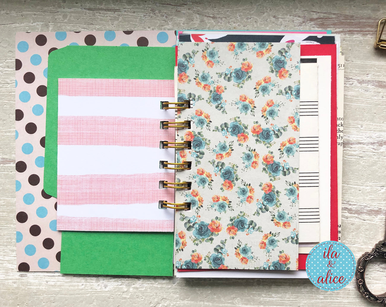 Planner with colorful pages on a wooden surface