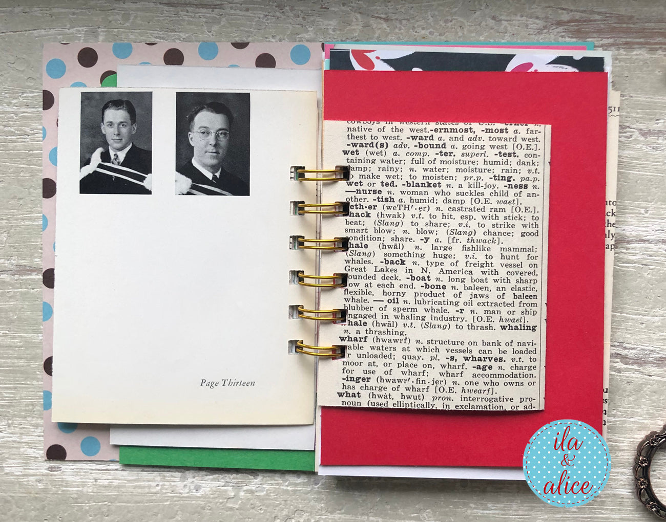 Open notebook with vintage-style pages featuring text and images on a wooden surface.