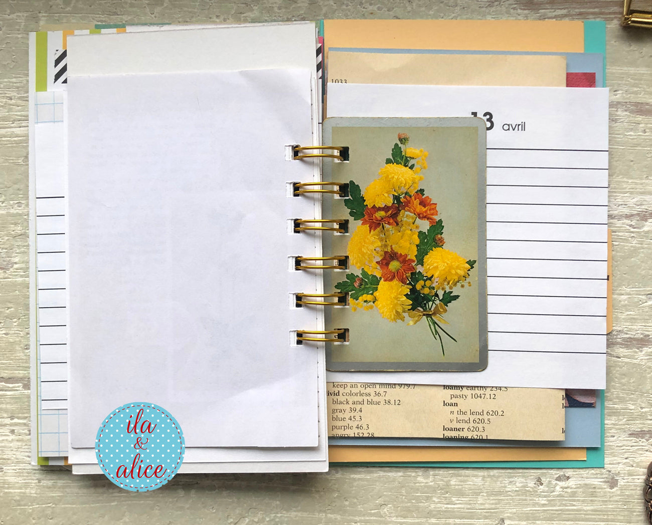 Planner with floral design and text on a wooden surface