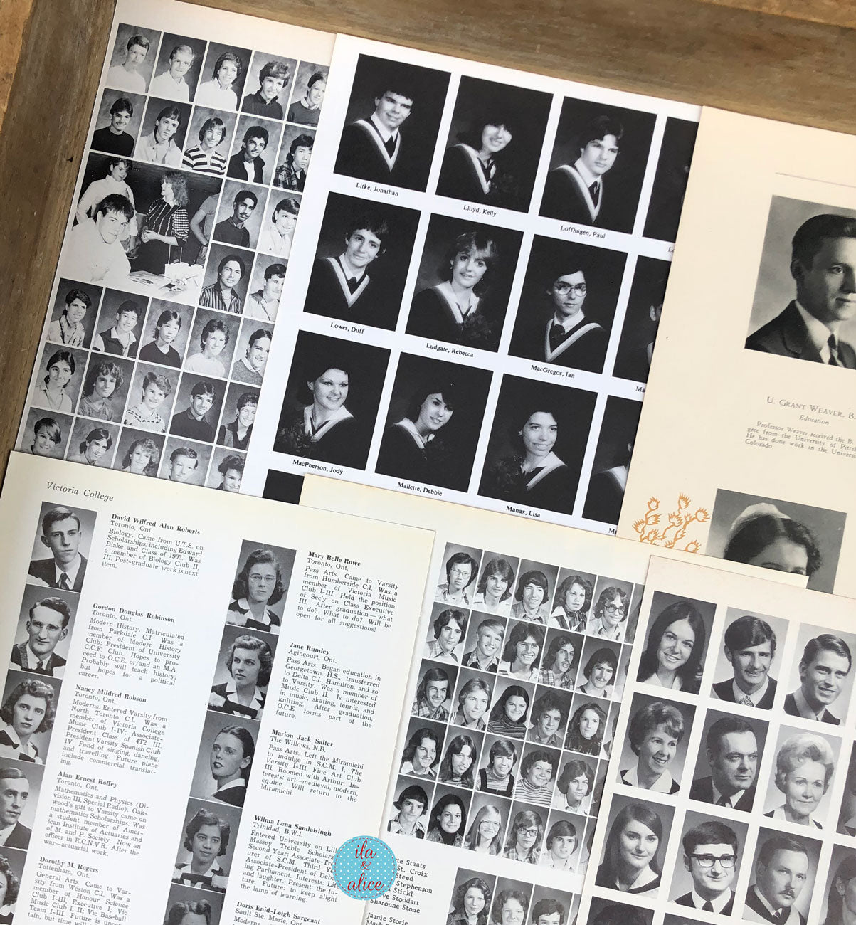 A collage of vintage black-and-white yearbook pages laid out on a wooden surface, featuring multiple small portrait photos, names, and handwritten notes.