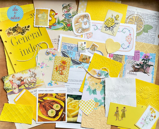 curated 8x12 junk journal ephemera pack with layered papers, botanical elements, and tuckable pieces. yellow theme.